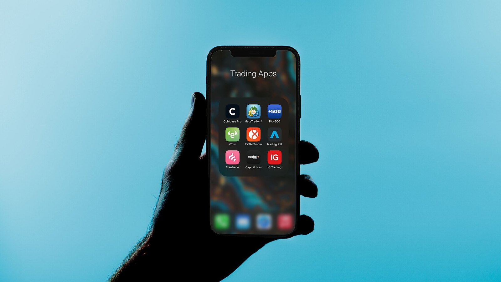 Trading apps on a phone screen. Illustration only
